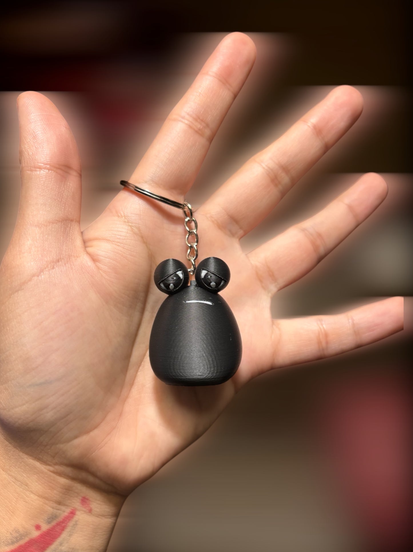 Llavero Black Pou Triste